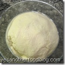Gather curds into a ball and squeeze excess whey out
